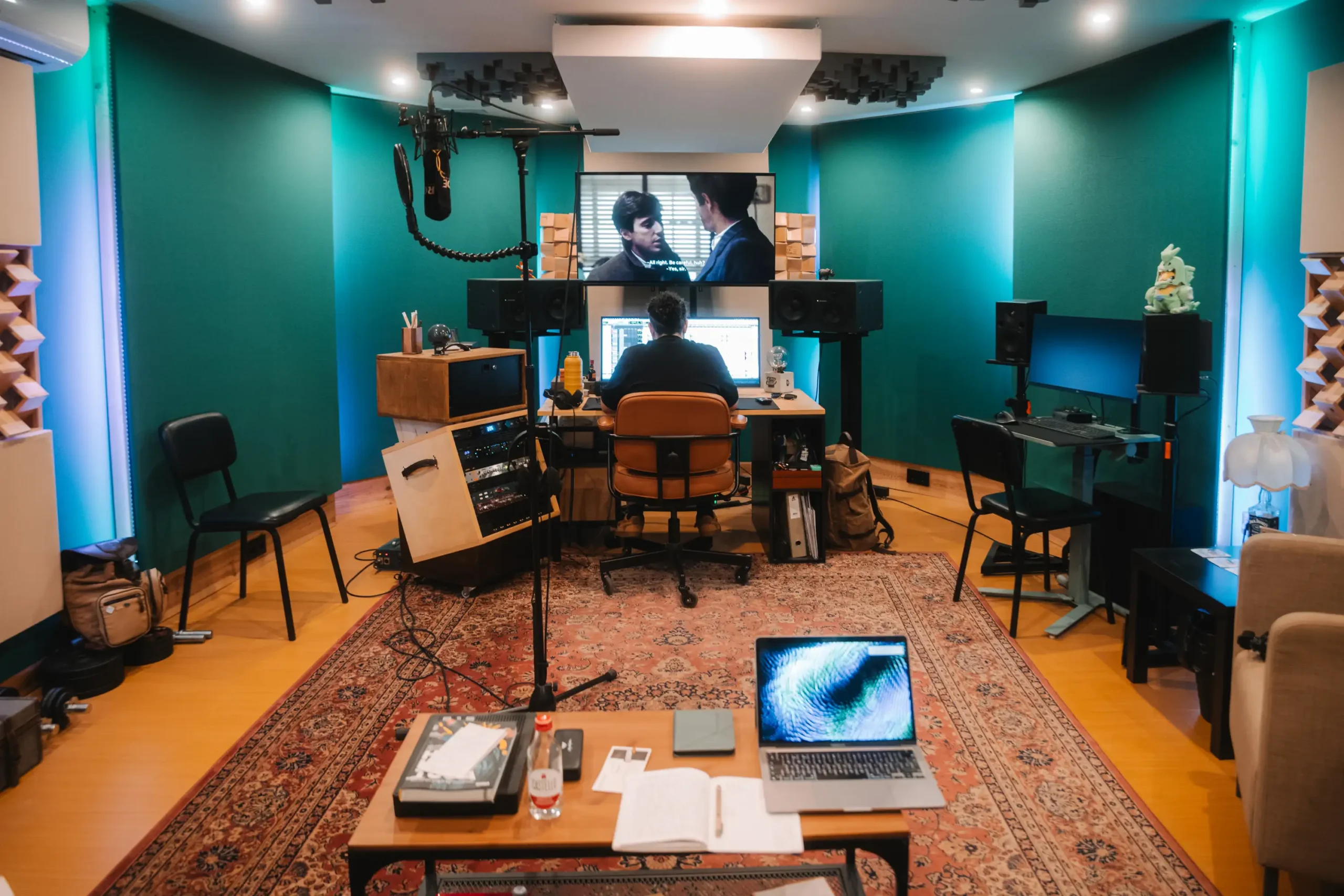 Recording and mixing room at Sine Factory studio in Aveiro, Portugal, featuring acoustic panels, studio monitors, and engineer working at the mixing desk.